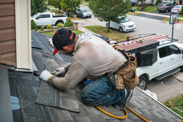 Professional Flat Roof Repair technician working in Williamsburg, IN